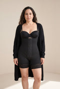 Hook-Front Bodysuit in Onyx with a black bra and an open cardigan