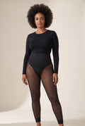 Sheer-Leg Shaping Legging in Onyx with a black long-sleeve top