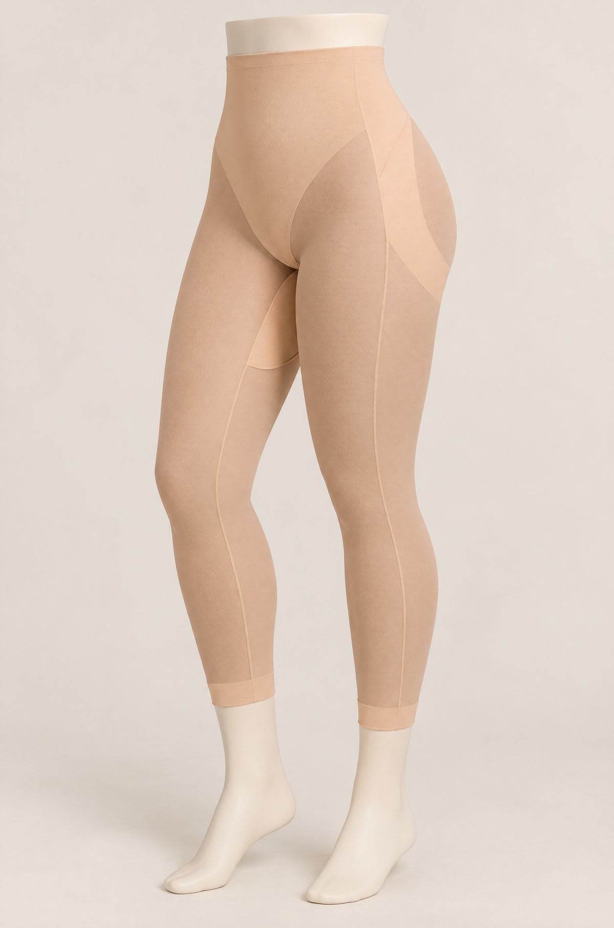 Sheer-Leg Shaping Legging in Sand on a dress form