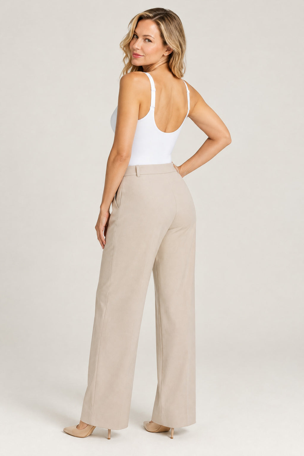 Plunge Thong Bodysuit in White, back, worn with trousers
