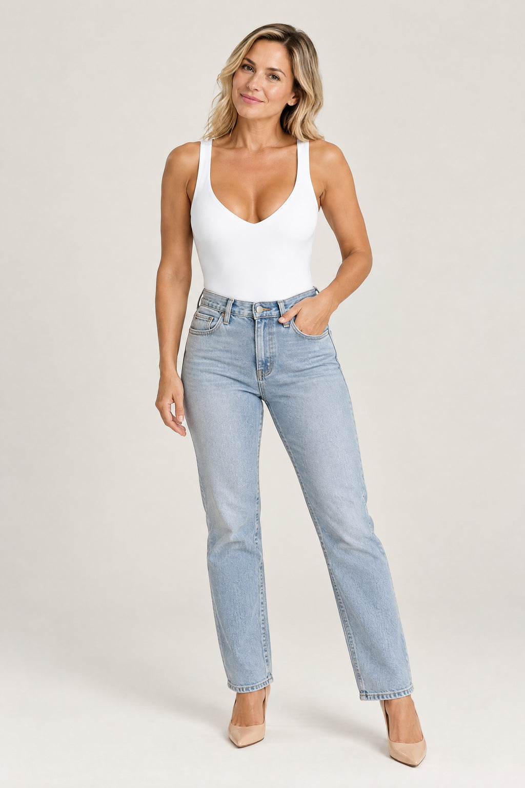 Plunge Thong Bodysuit in White, worn with jeans