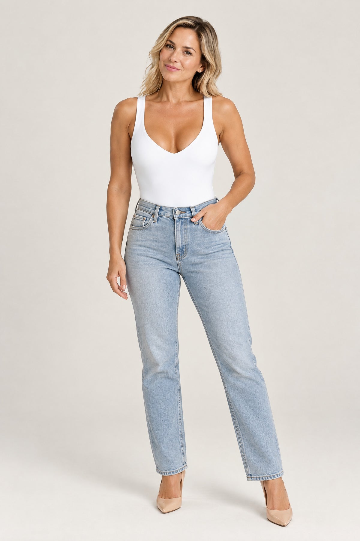 Plunge Thong Bodysuit in White, worn with jeans