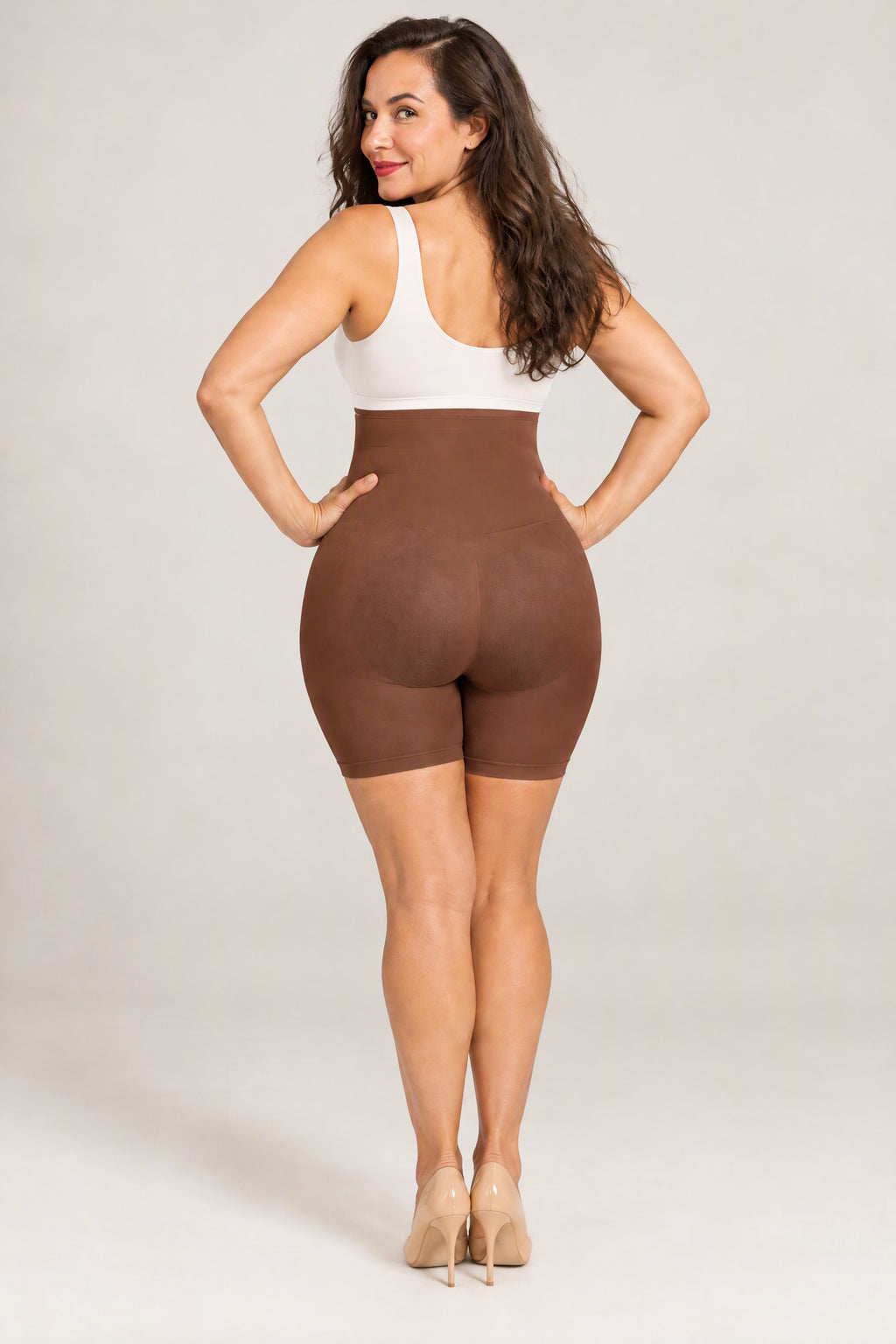 Seamless High-Waist Shaping Shorts in Brown, back, worn with a white top