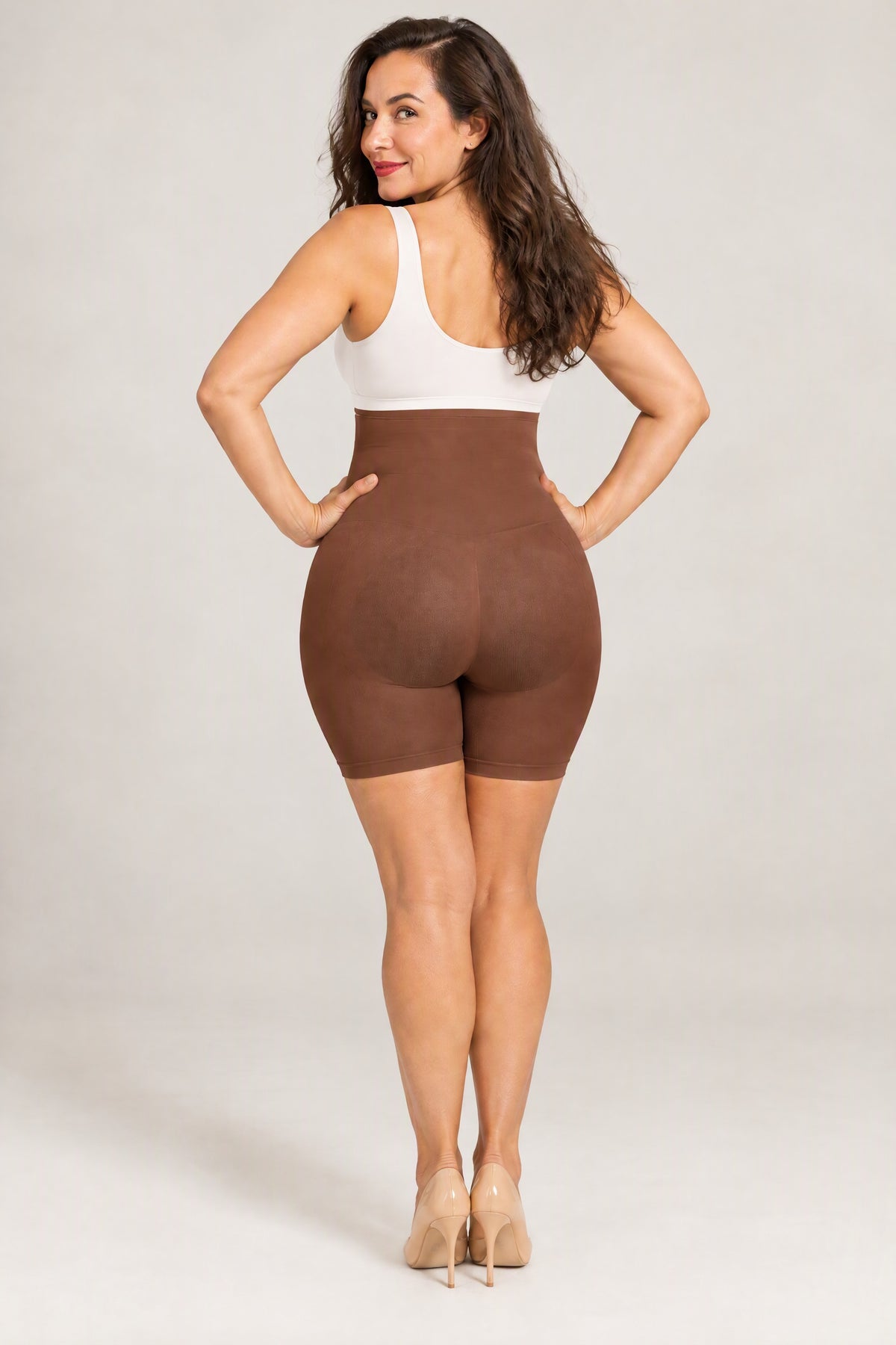 Seamless High-Waist Shaping Shorts in Brown, back, worn with a white top